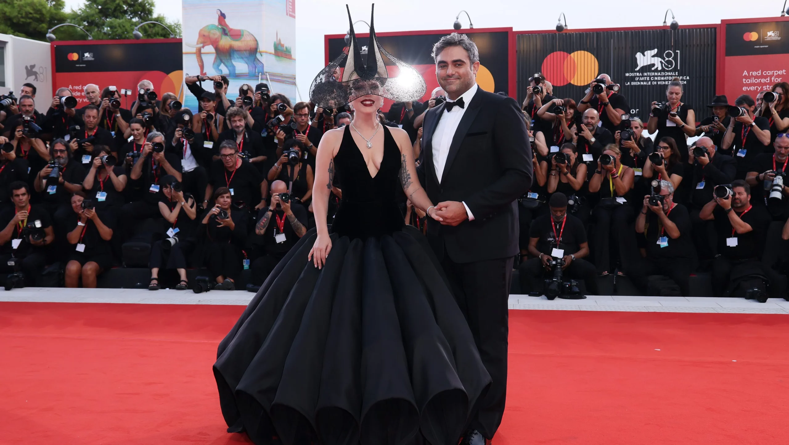 Lady Gaga and Michael Polansky make a stunning appearance at Venice Film Festival.